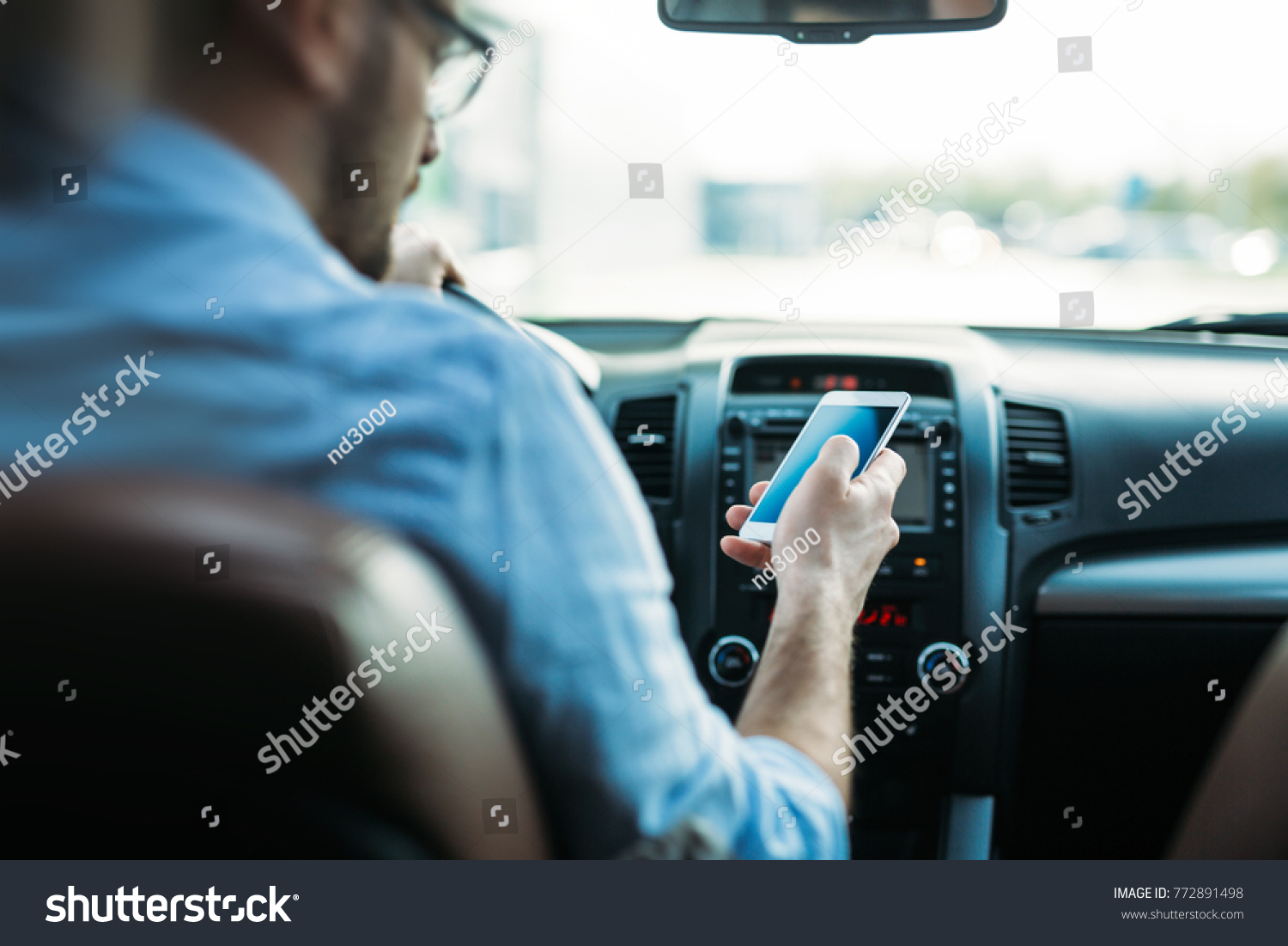 man using phone while driving the car #772891498