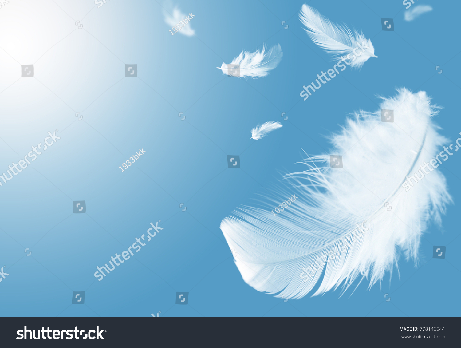 Light fluffy a white feathers floating in the sky with copy space. Feather abstract. Freedom concept background. #778146544