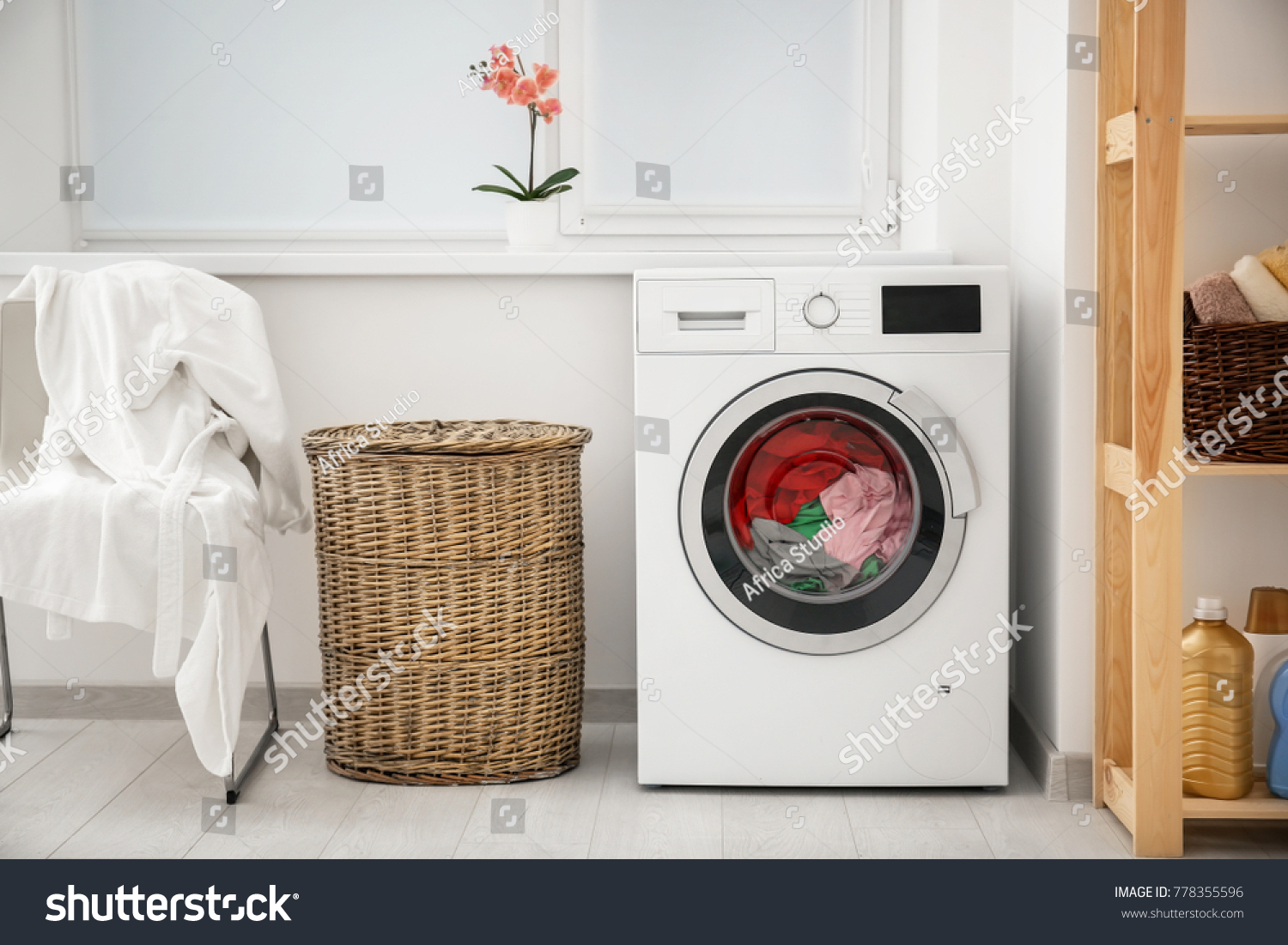 Laundry in washing machine and basket indoors #778355596