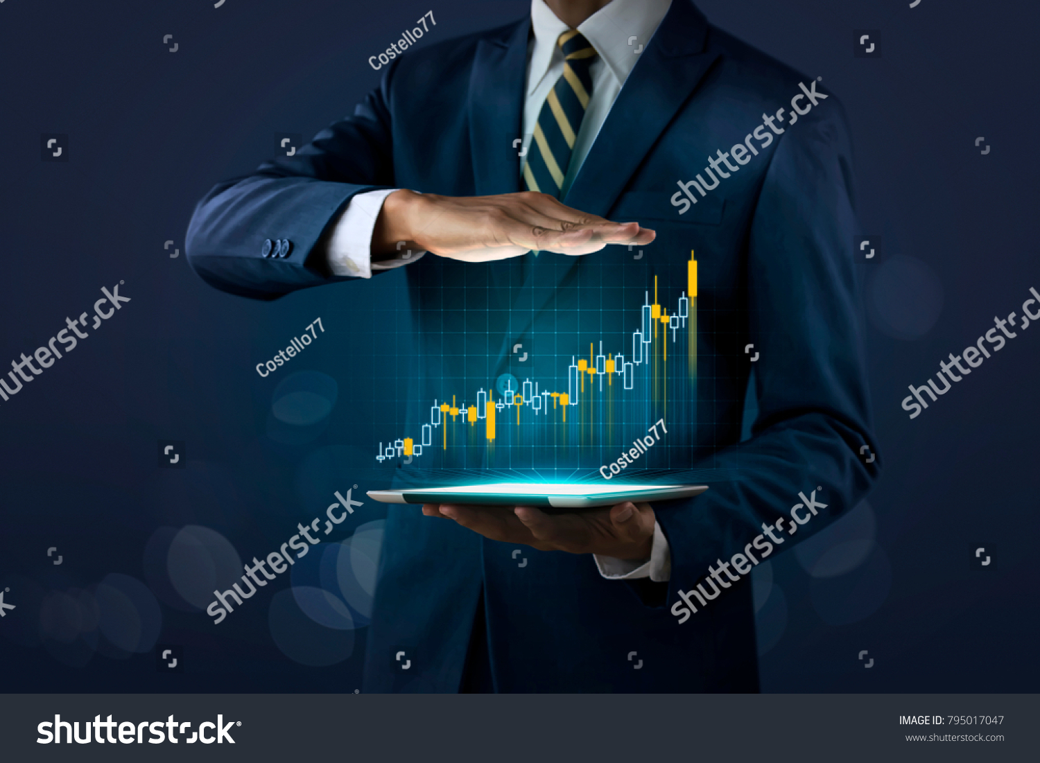 Business growth, progress or success concept. Businessman is showing a growing virtual hologram stock on dark tone background. #795017047