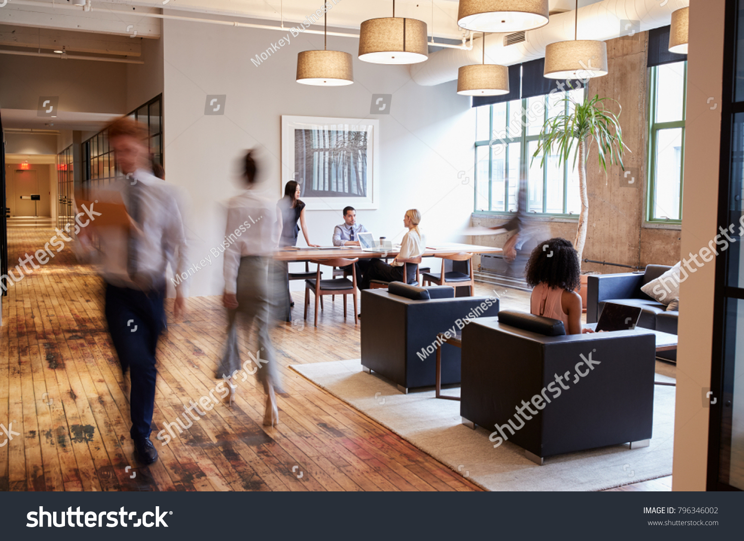 Business people at work in a busy luxury office space #796346002