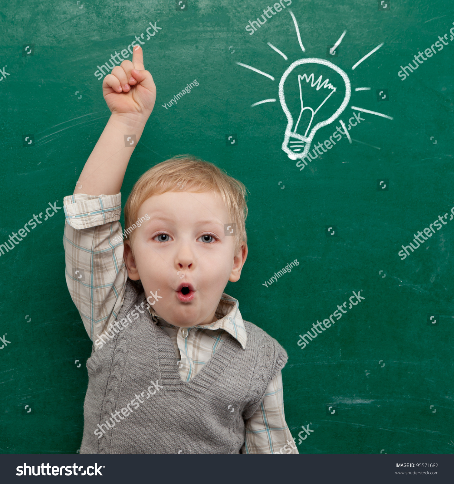 Cheerful smiling child at the blackboard. School concept #95571682