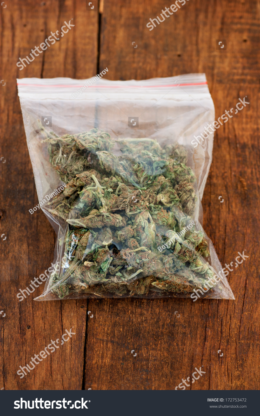 Big Plastic Bag Of Weed Or Marijuana On Wooden Background Stock Photo ...