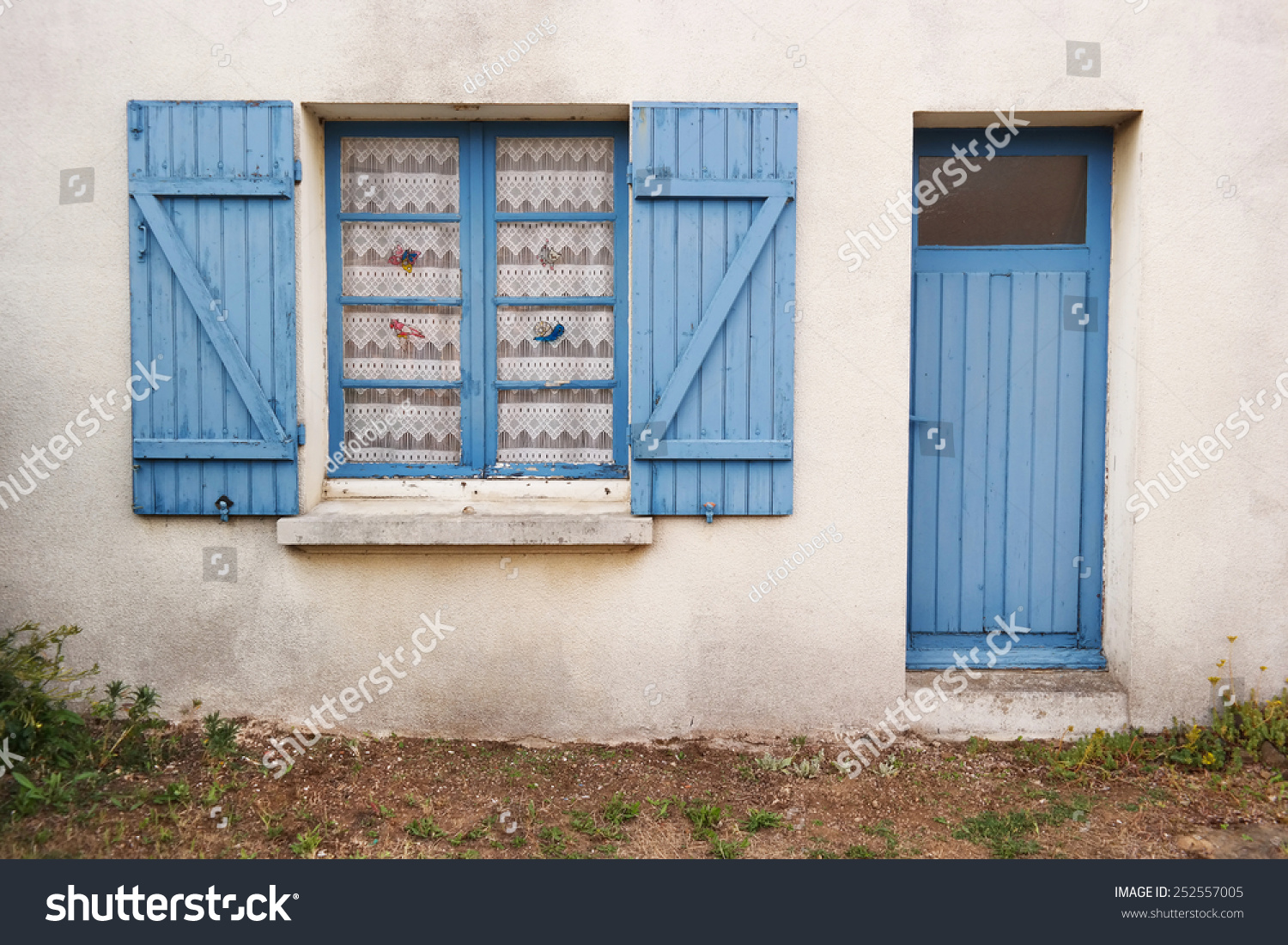 Cottage With Traditional Breton Blue Window Shutters And Door In ...