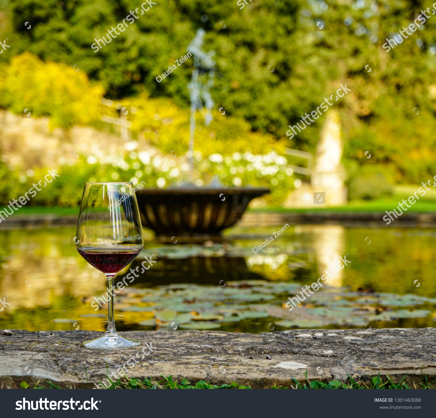 Red Wine Glass Resting On Edge Stock Photo Edit Now 1301463088