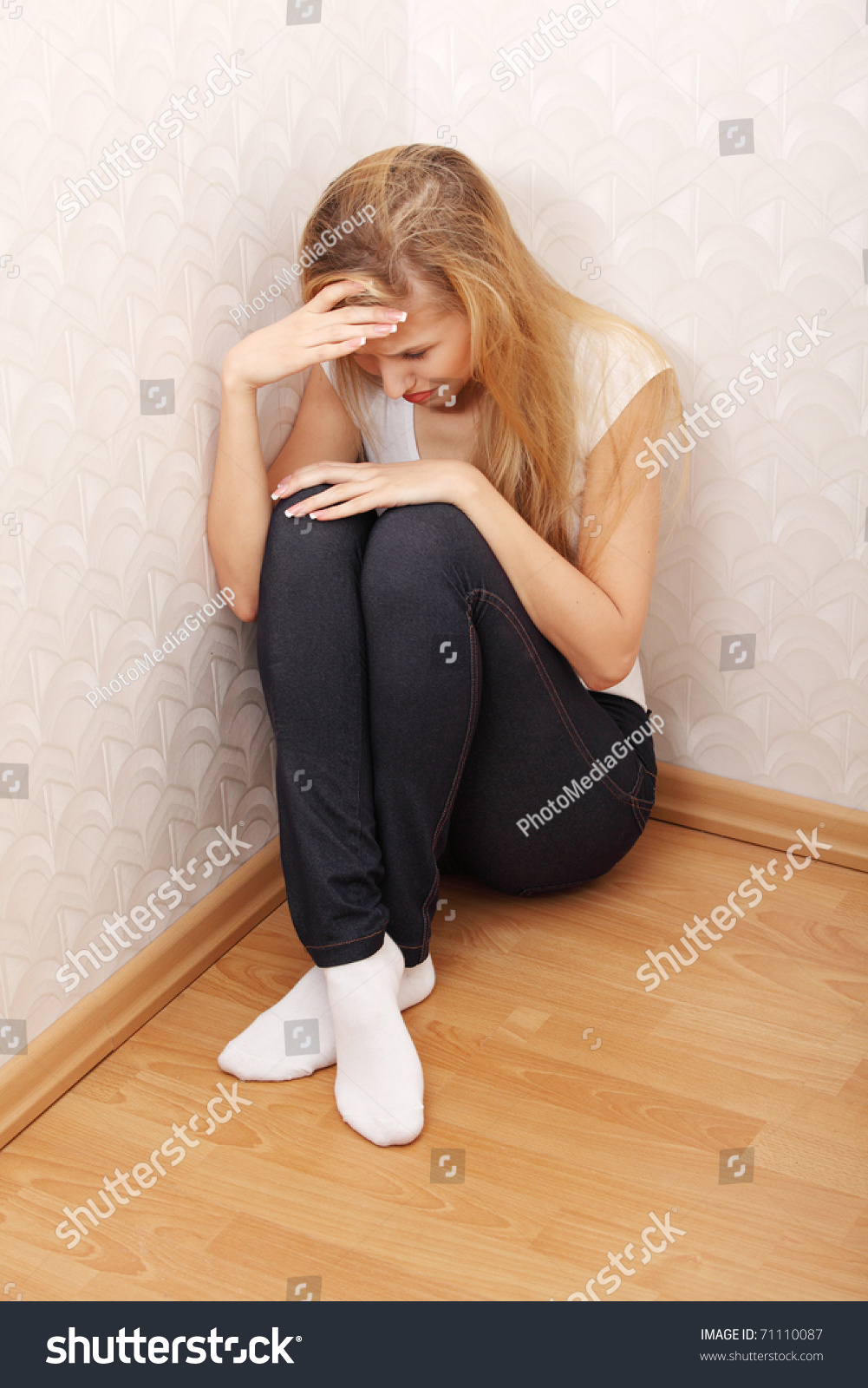 Scared Abused Woman Sitting In The Corner Of The Room. Stock Photo ...