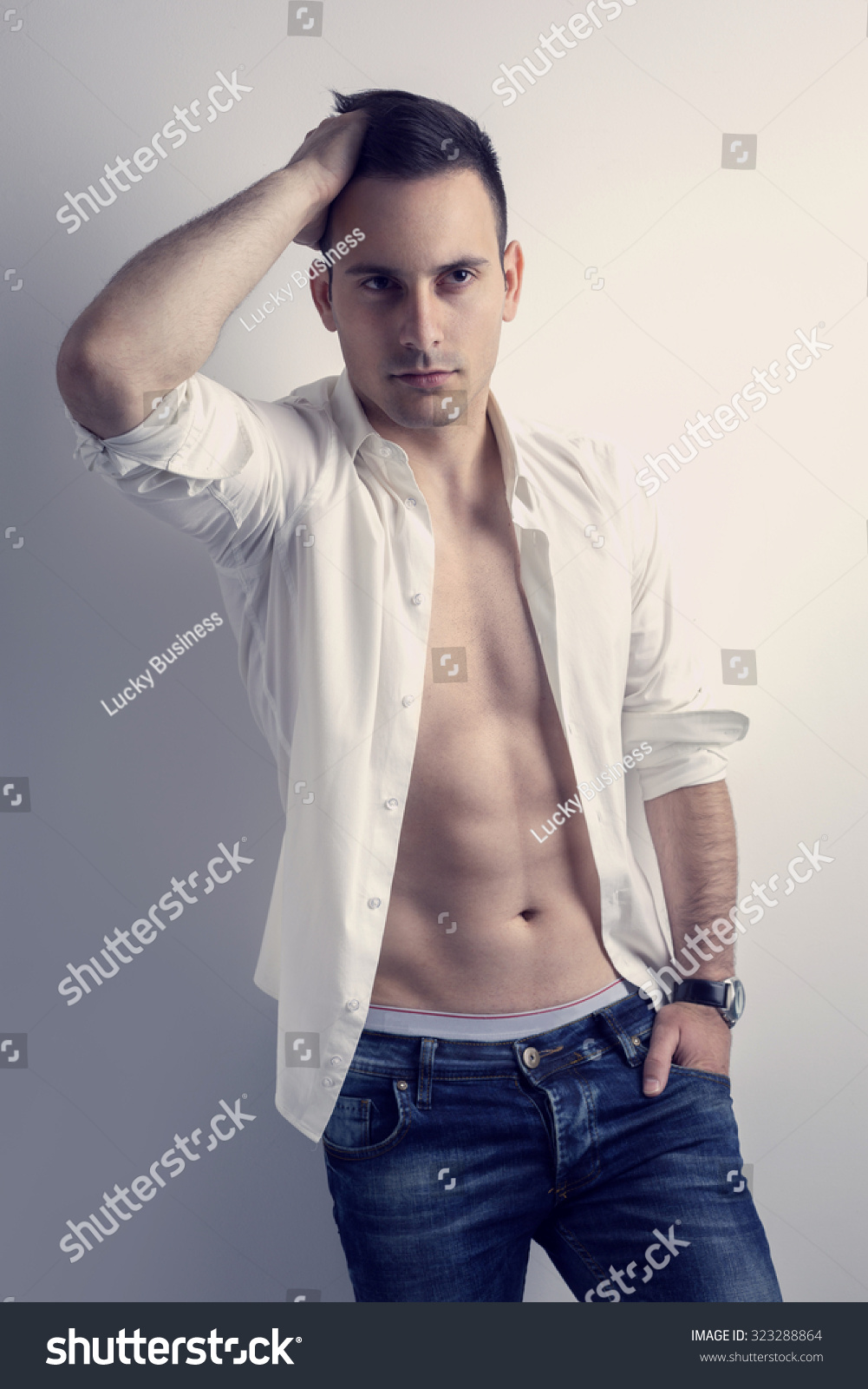 Sexy Man Unbuttoned Shirt Leaning Against Foto Stok Shutterstock