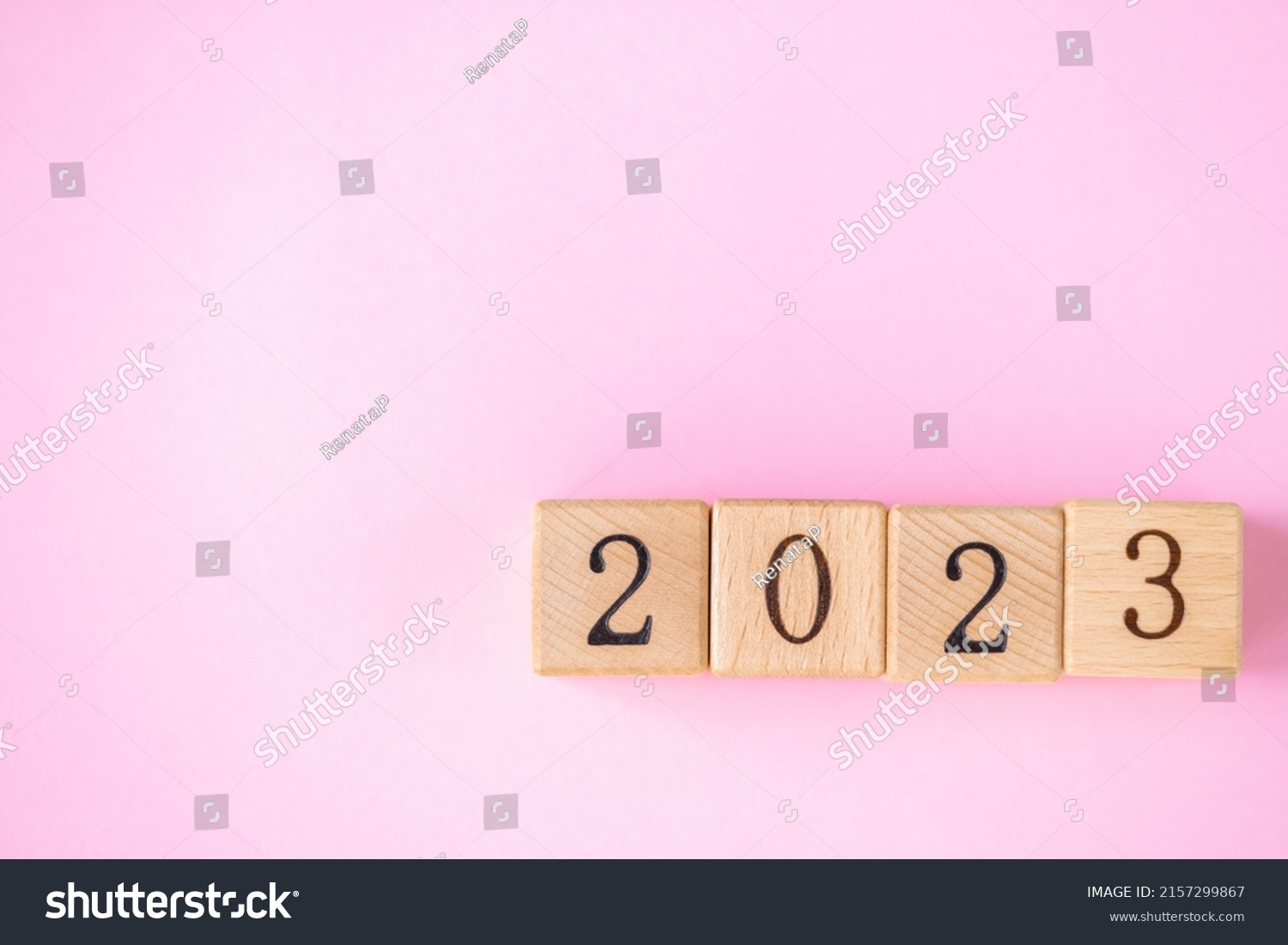 Stock Photo  Word Is Made Of Wooden Blocks On The Pink Background Happy New Year 2157299867 