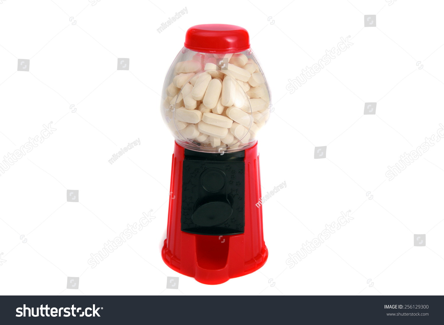 一个玩具胶球机充满白色药片和药物。代表危险