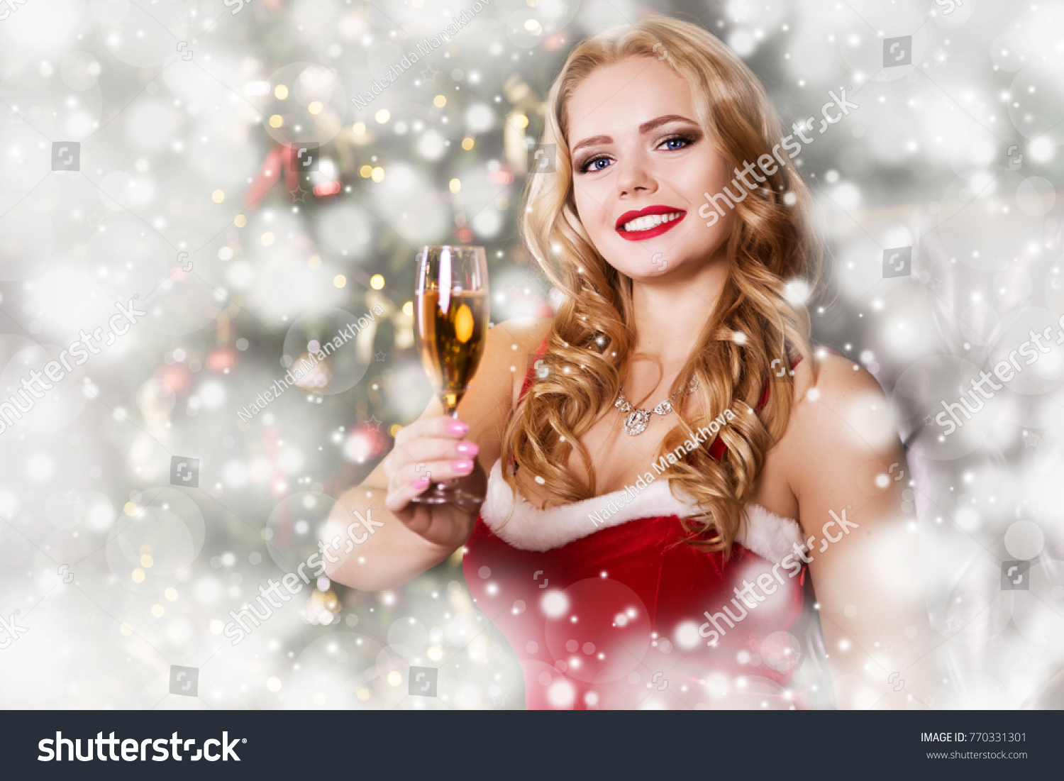 A Beautiful Blonde Woman In A Santa Claus Red Dress Is Surprised Shocked And Ecstatic A Beautiful Blonde Woman In A Santa Claus Red Dress Is Surprised Shocked And Ecstatic