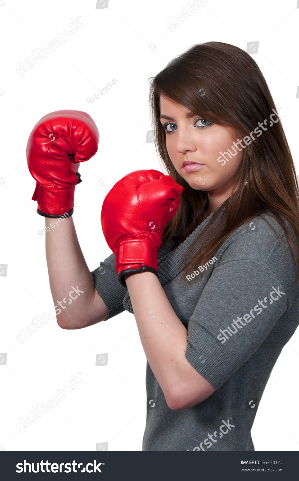 A Beautiful Young Woman Wearing A Pair Of Boxing Gloves Stock Photo ...