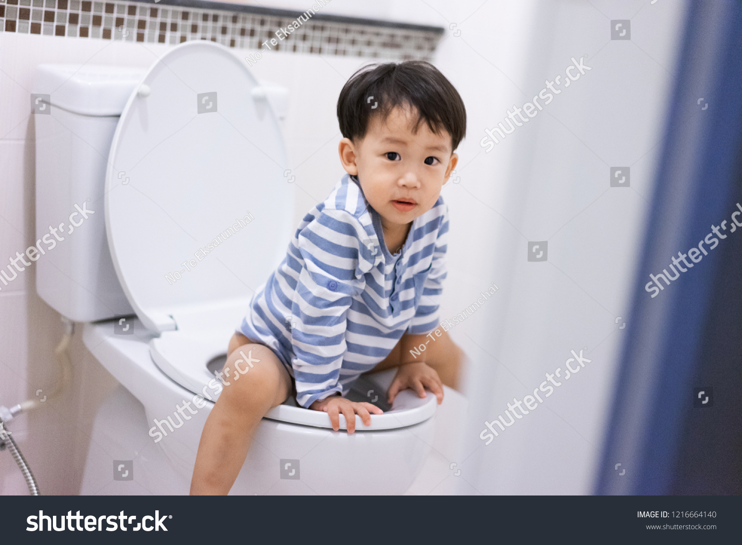Boy Sitting On Toilet Suffering Constipation Stock Photo 1216664140 ...