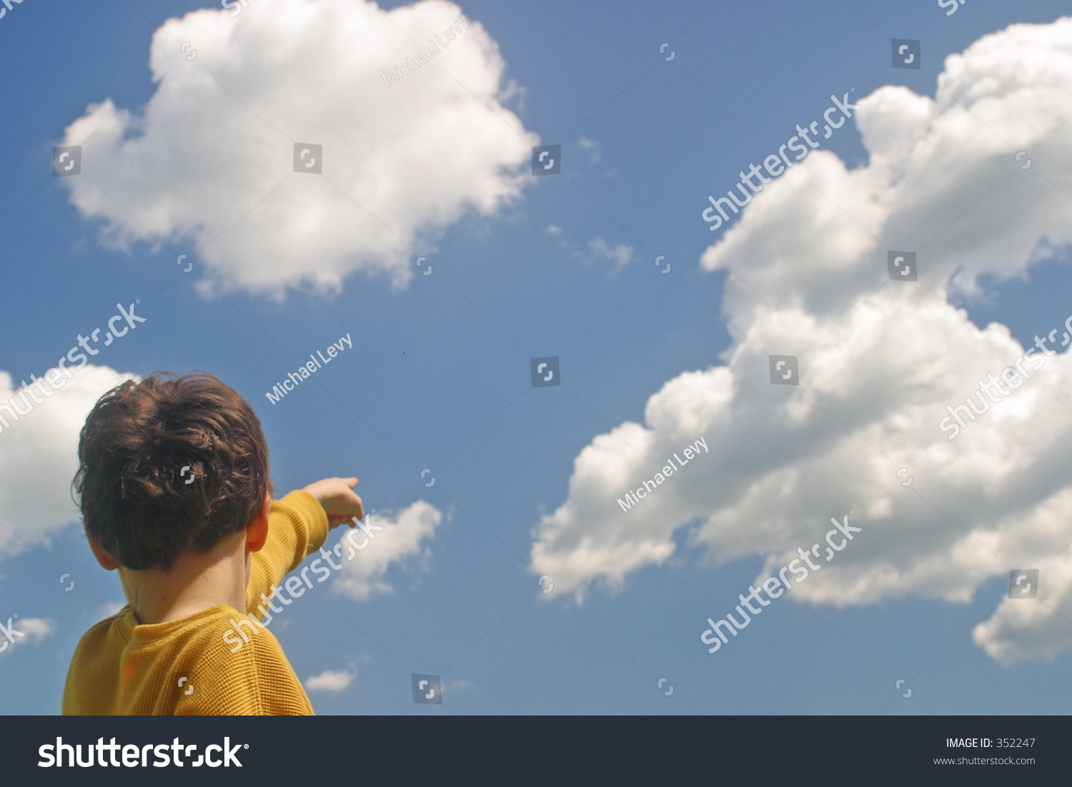 A Boy Pointing Up At The Clouds Stock Photo 352247 : Shutterstock