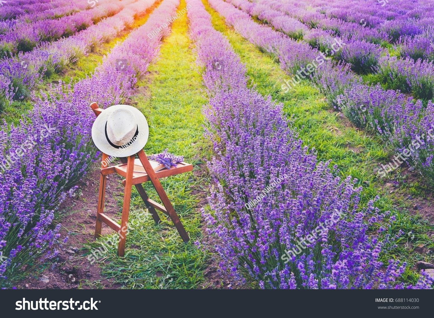 chair-hanged-over-hat-open-book-stock-photo-688114030-shutterstock