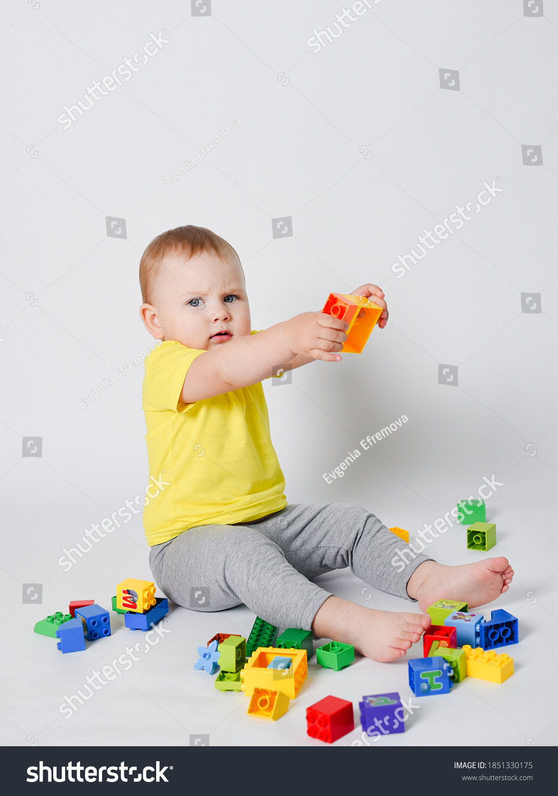 Child Sitting On White Background Yellow Stock Photo 1851330175 ...