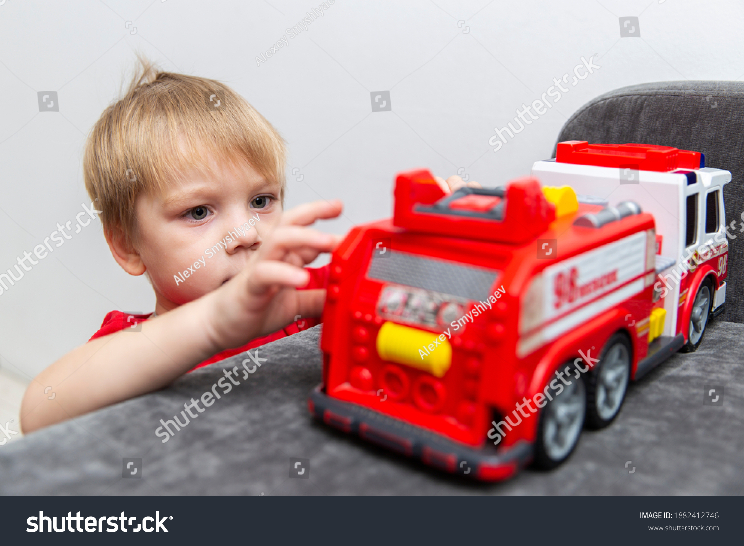 child-toy-boy-playing-toy-car-stock-photo-1882412746-shutterstock