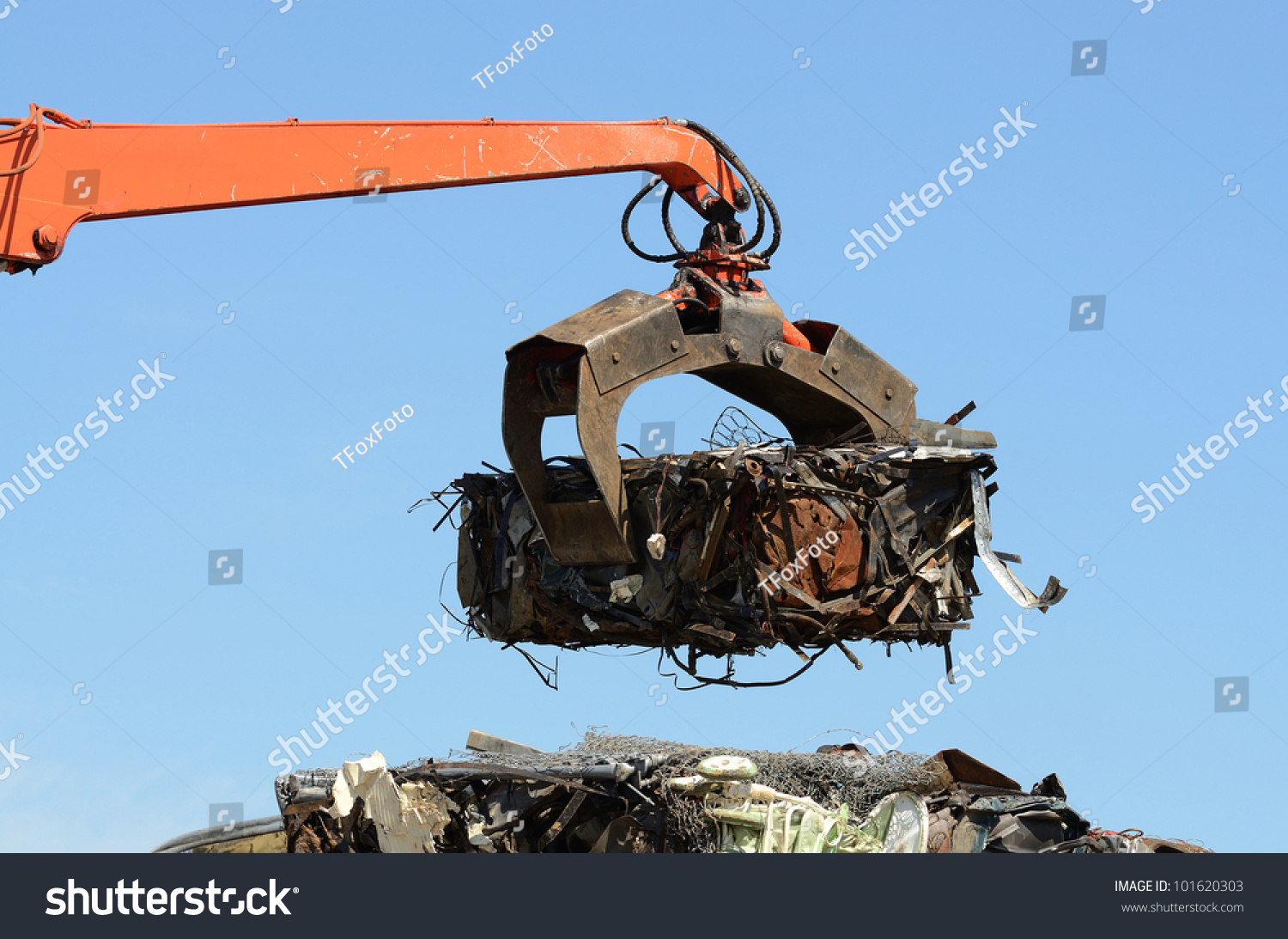 stock-photo-a-claw-on-a-compactor-moves-