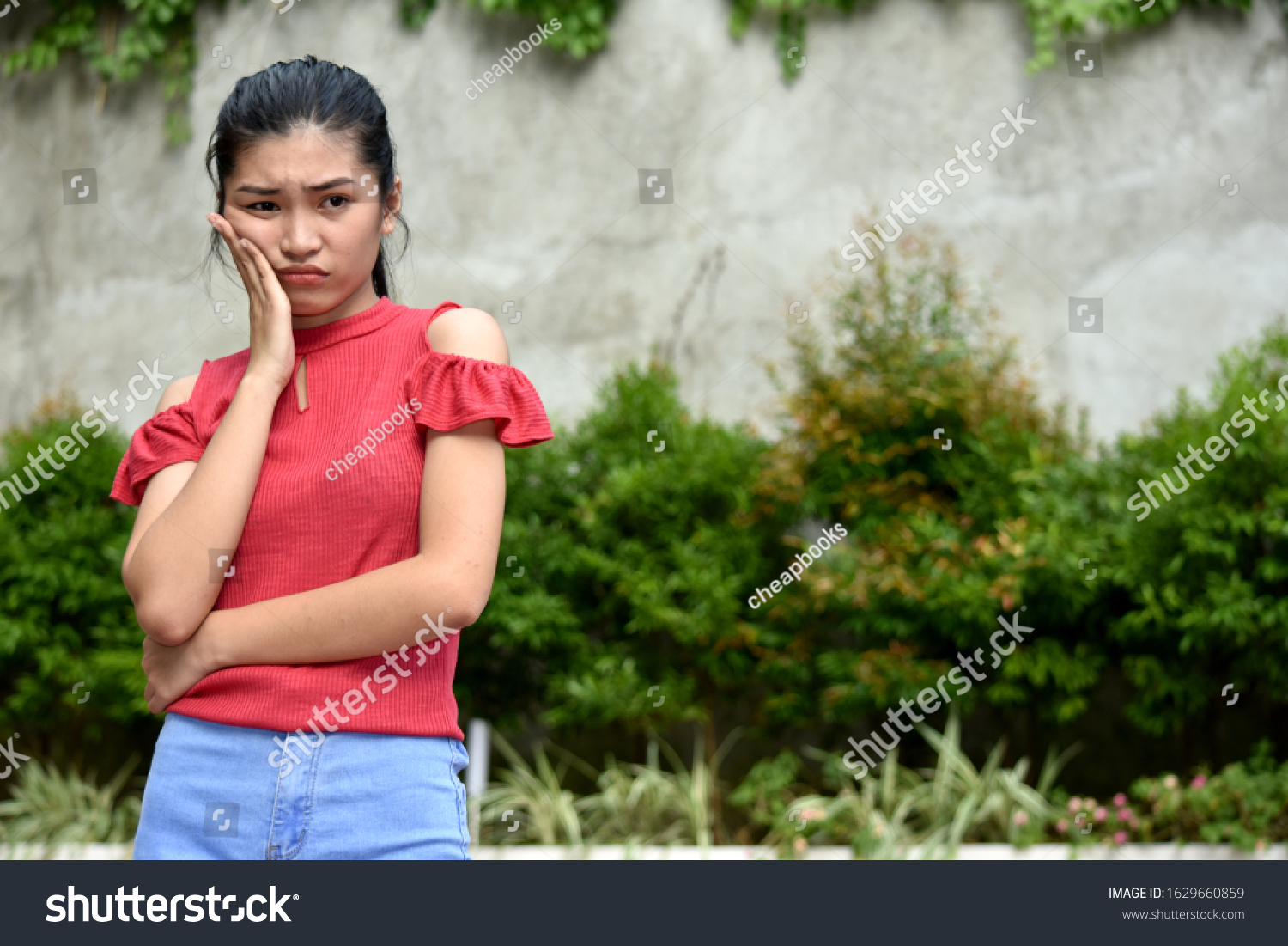 Confused Beautiful Filipina Girl Stock Photo (Edit Now) 1629660859