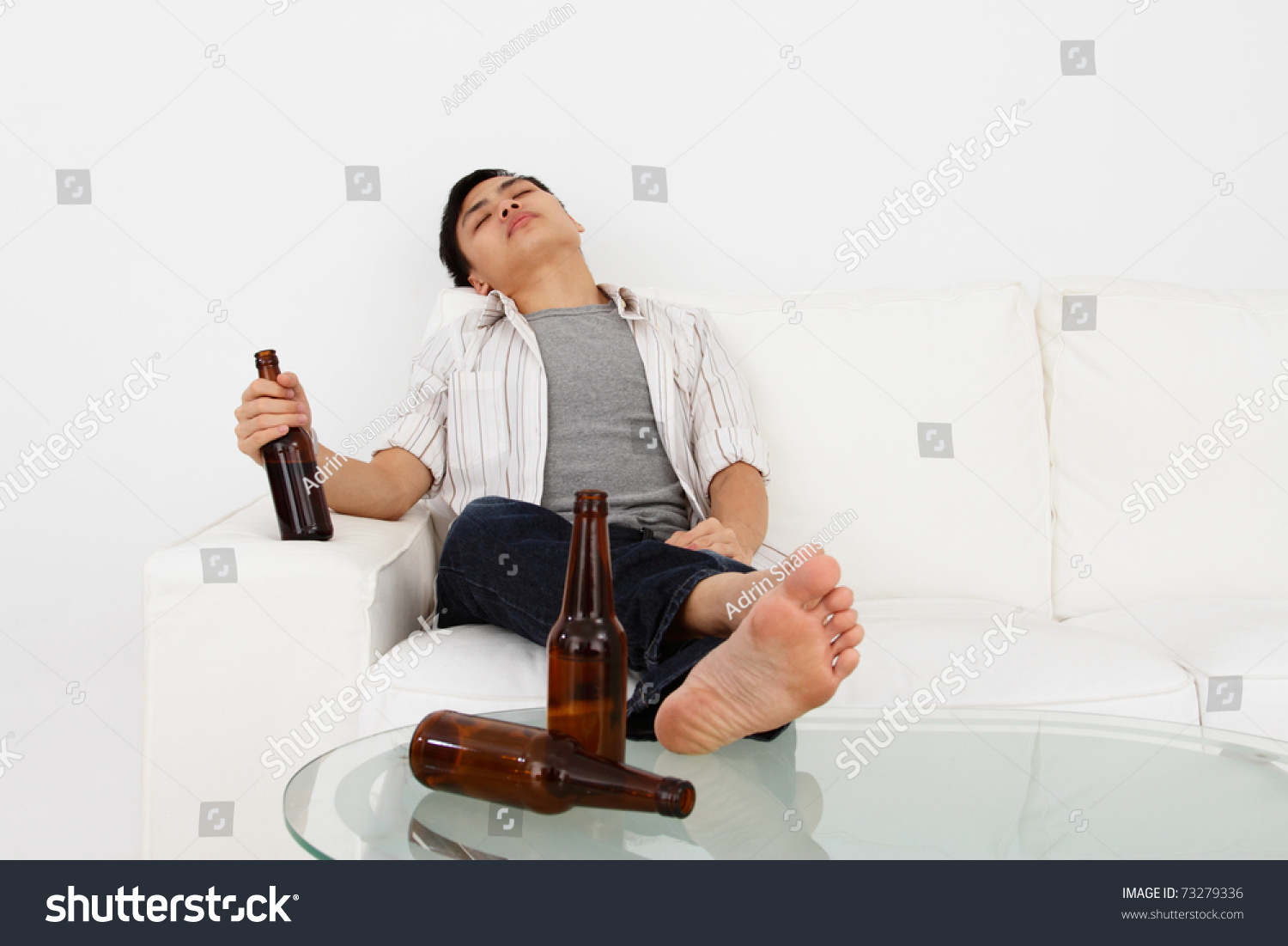 A Drunk Man On A Sofa With Beer Bottles Stock Photo 73279336 : Shutterstock