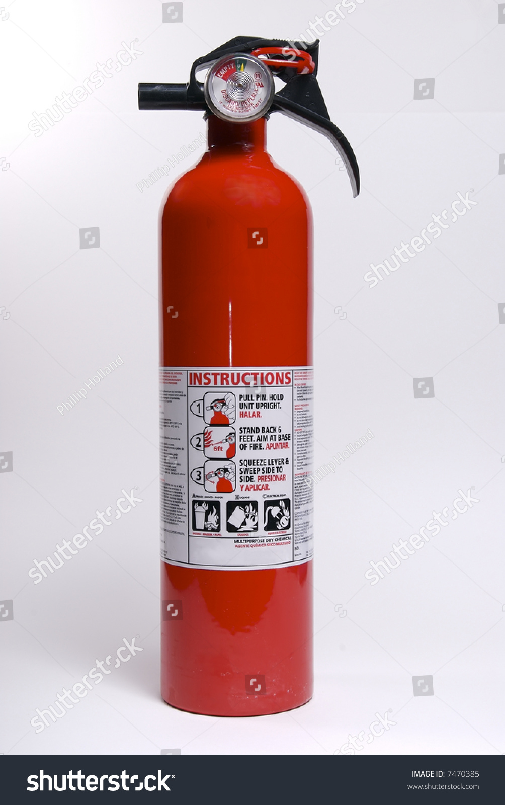 A Fire Extinguisher Isolated Against A White Background. Stock Photo ...