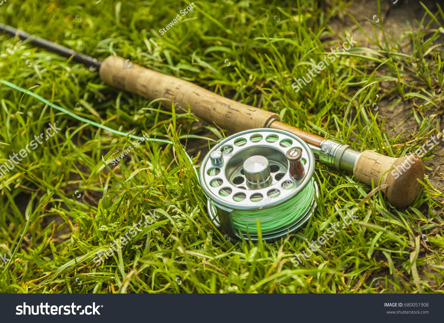 https://image.shutterstock.com/z/stock-photo-a-fly-fishing-rod-and-reel-lays-on-the-grass-ready-to-be-used-ideal-space-for-copy-and-suitable-680051908.jpg
