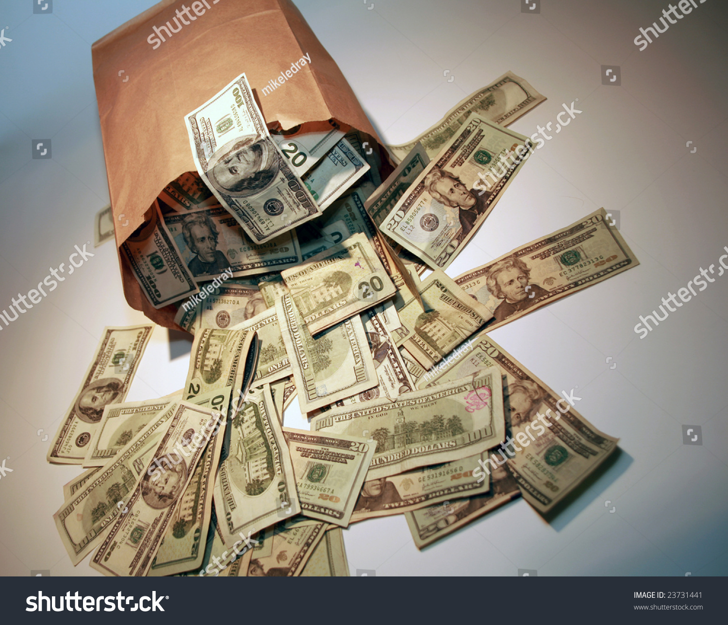 A Generic Brown Paper Bag Over Flowing With Money Stock Photo 23731441 ...