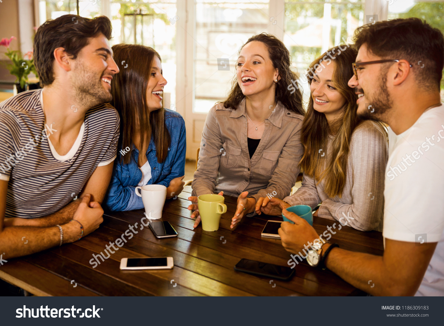 Group Friends Talking Drinking Coffee Cafe Stock Photo 1186309183 ...