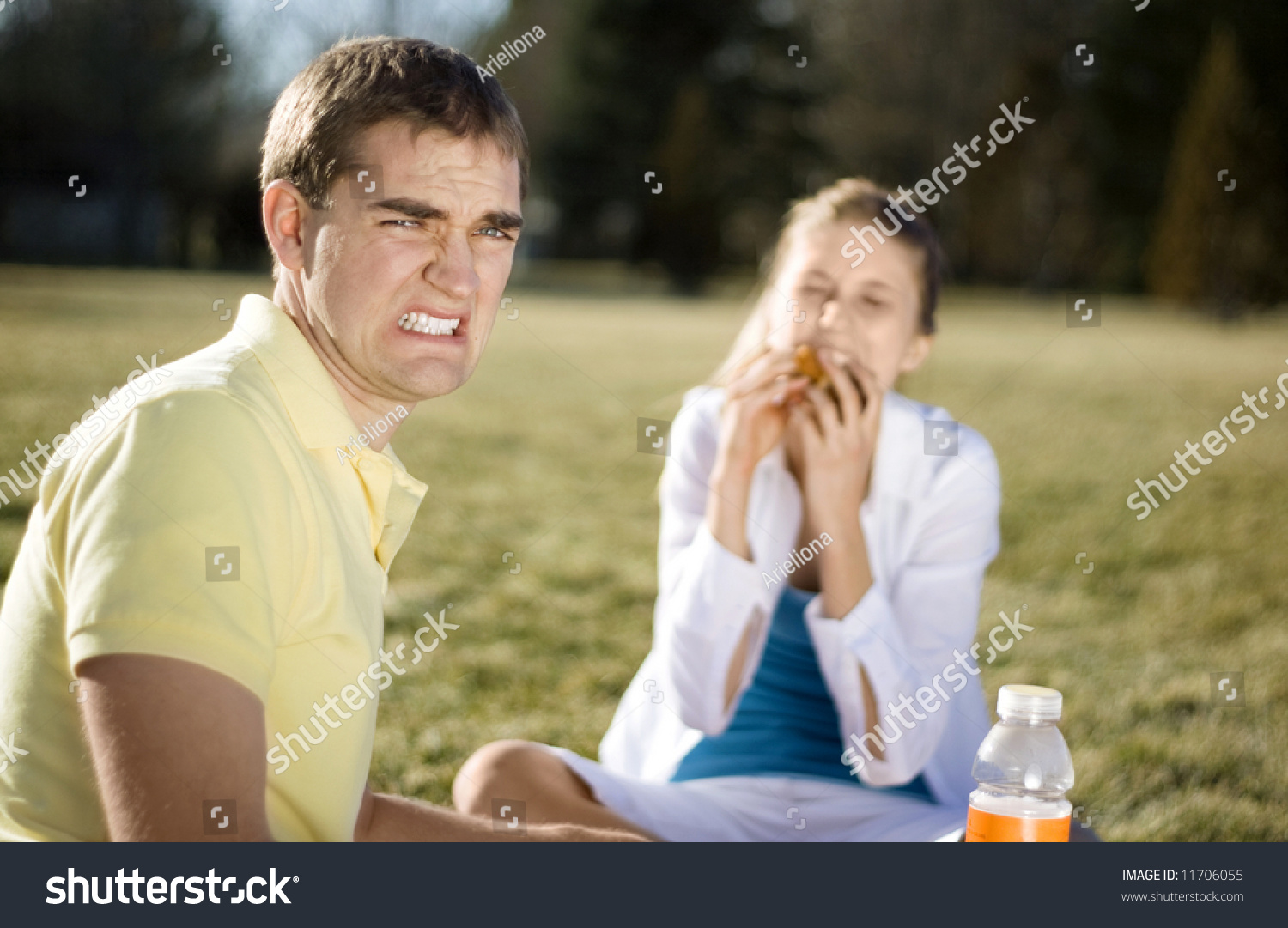 stock-photo-a-guy-cringing-as-his-date-stuff-her-face-with-food-11706055.jpg