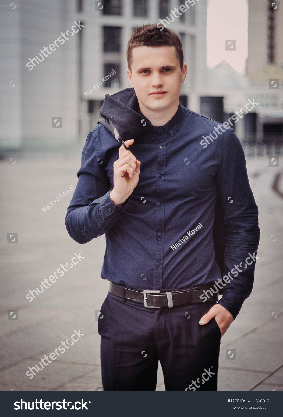 black coat and blue shirt