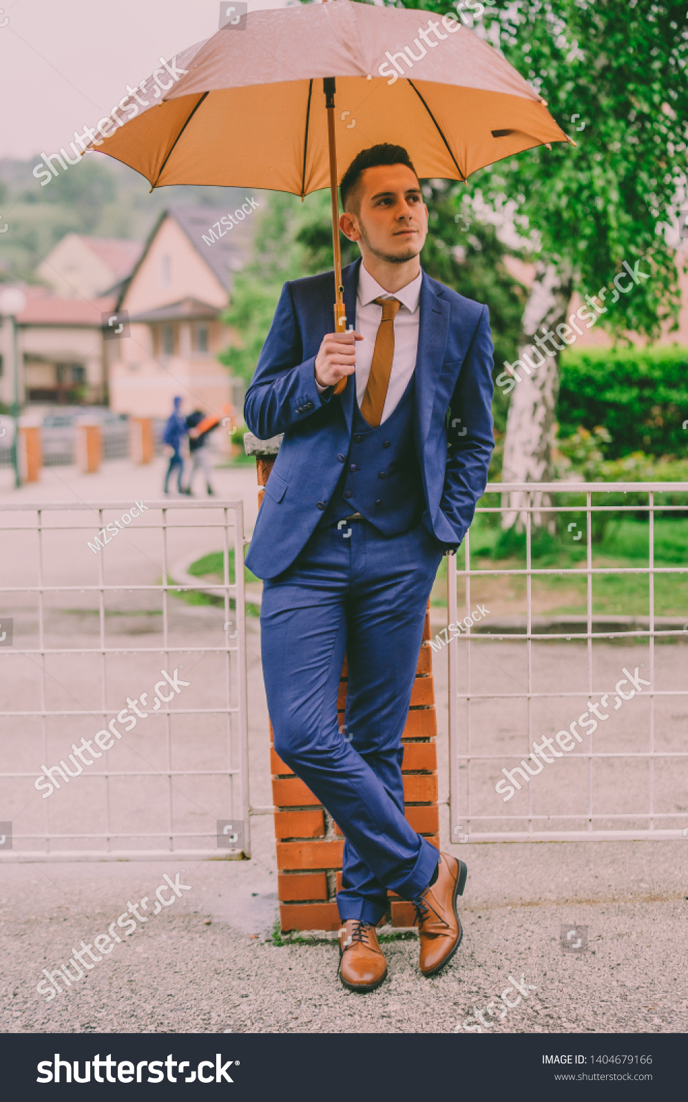 tan shoes with blue suit