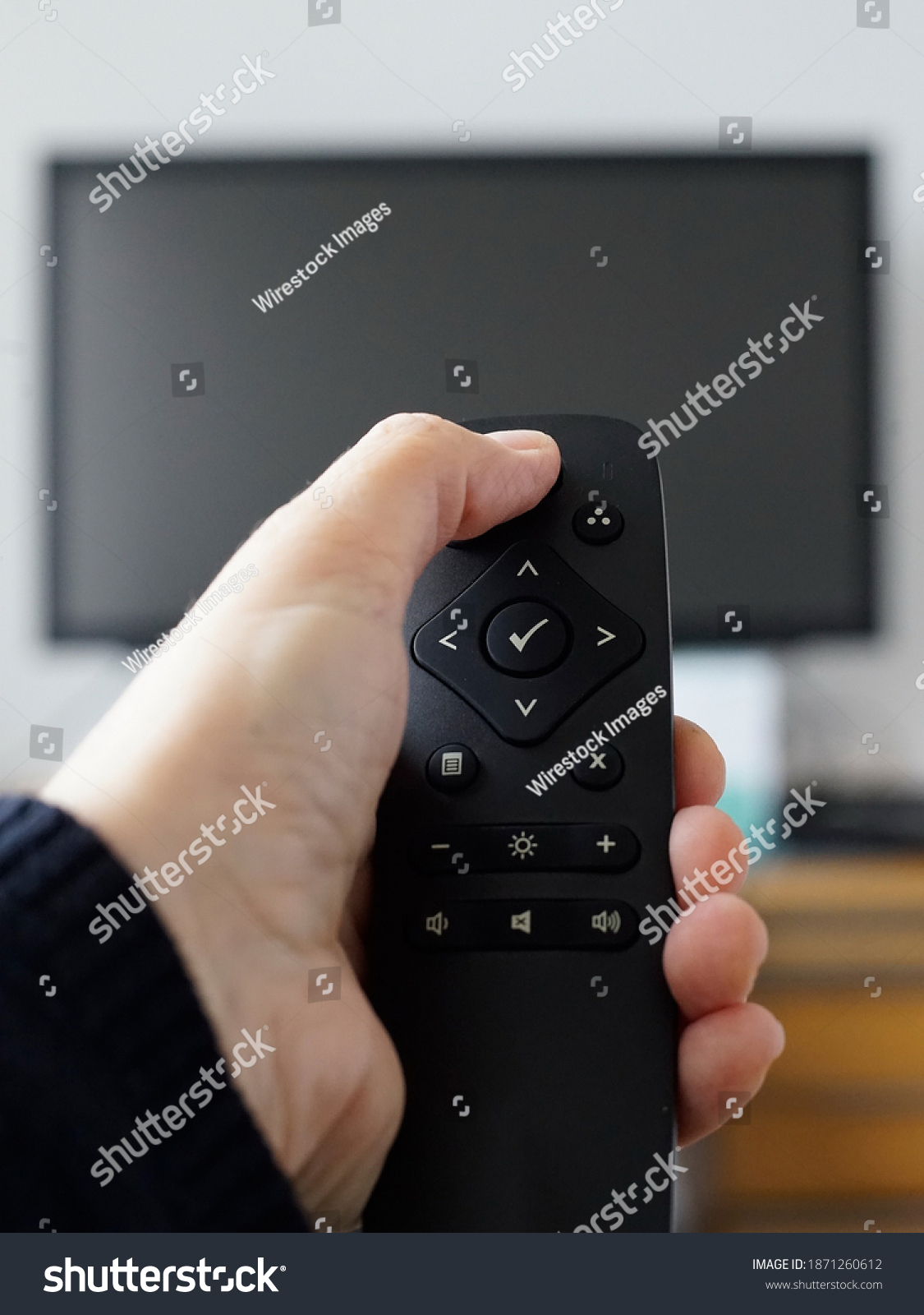 Hand Holding Remote Control Turning Tv Stock Photo 1871260612 ...