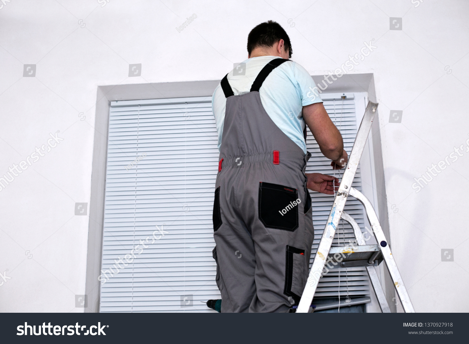 Handyman Uniform Installing New Window Blinds Stock Photo Edit Now 1370927918