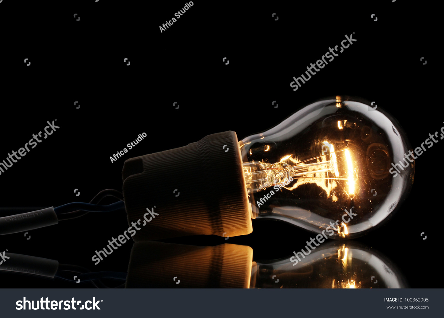 Lit Light Bulb On Black Background Stock Photo (Edit Now) 100362905