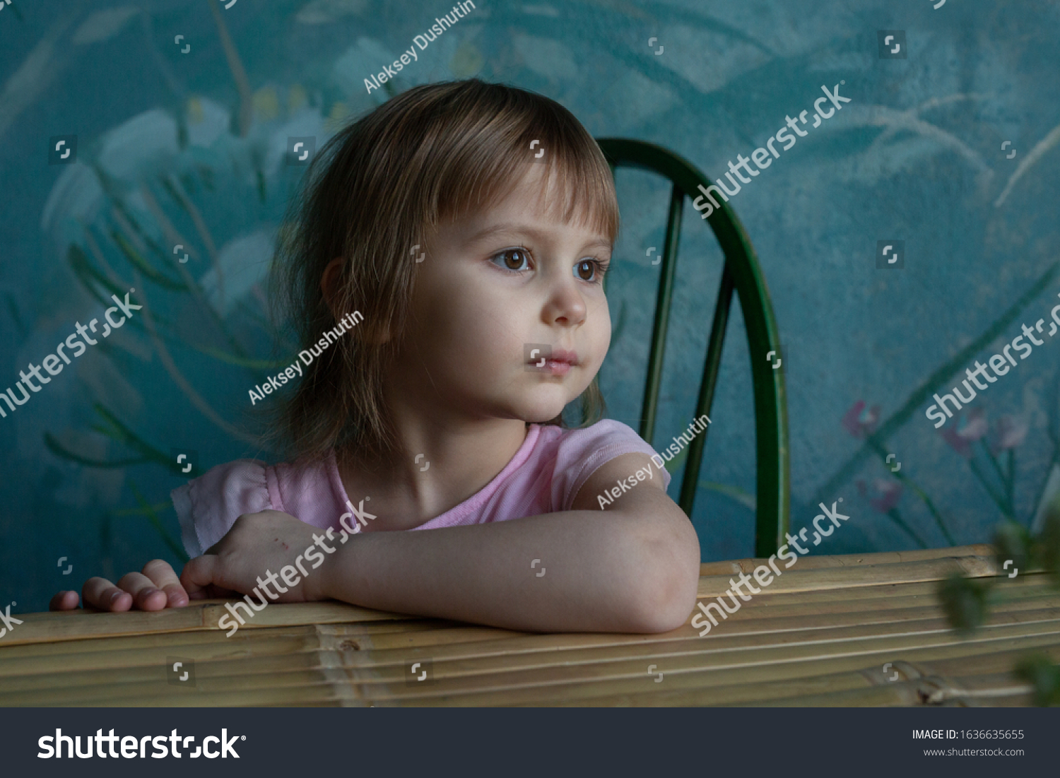 Little Girl Sits Table Looks Sideways Stock Photo 1636635655 | Shutterstock