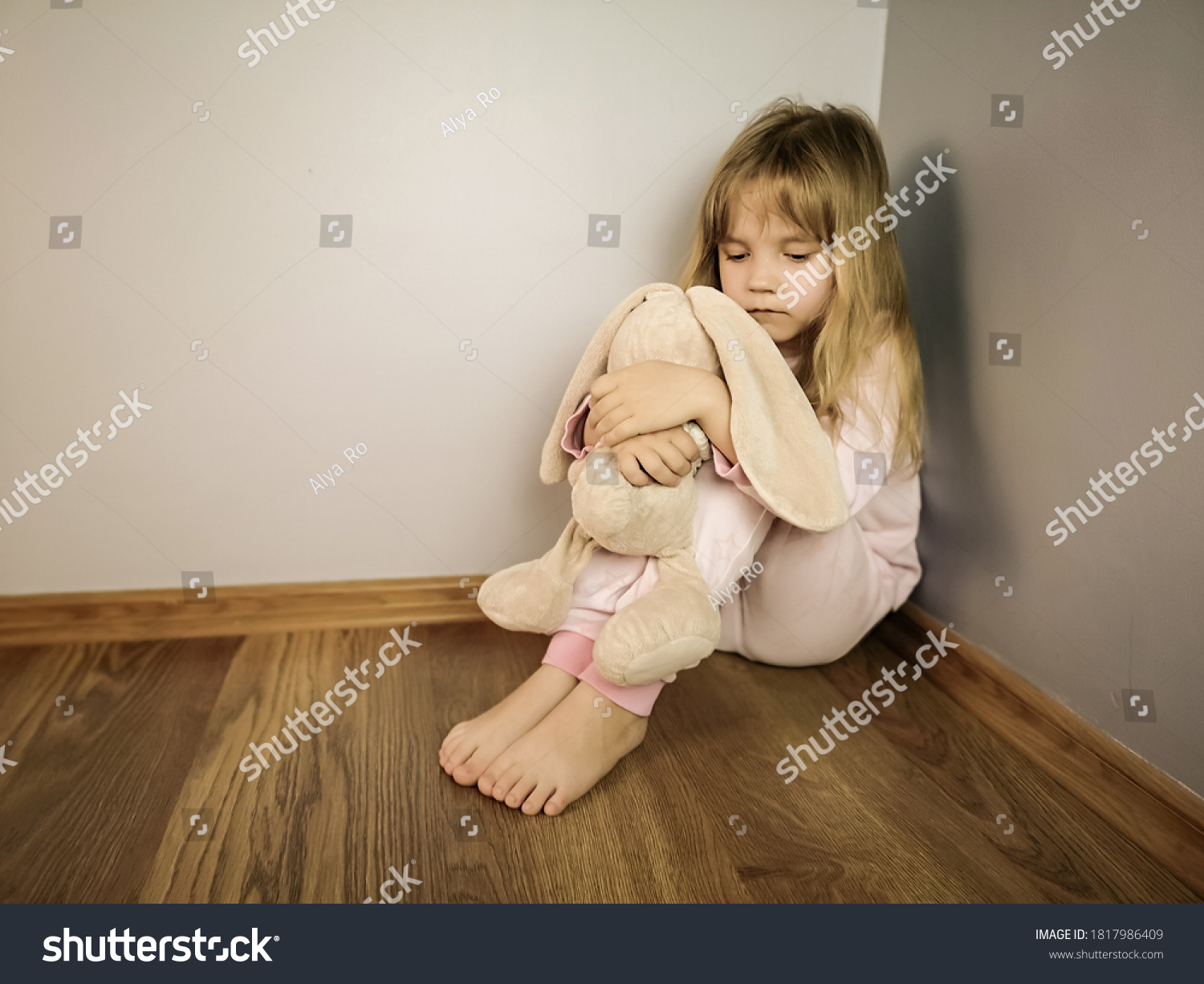 Little Girl Sits On Floor Corner Stock Photo (Edit Now) 1817986409