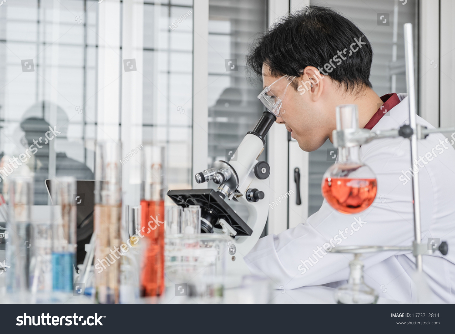 Male Scientist Black Hair Wearing White Stock Photo Edit Now 1673712814