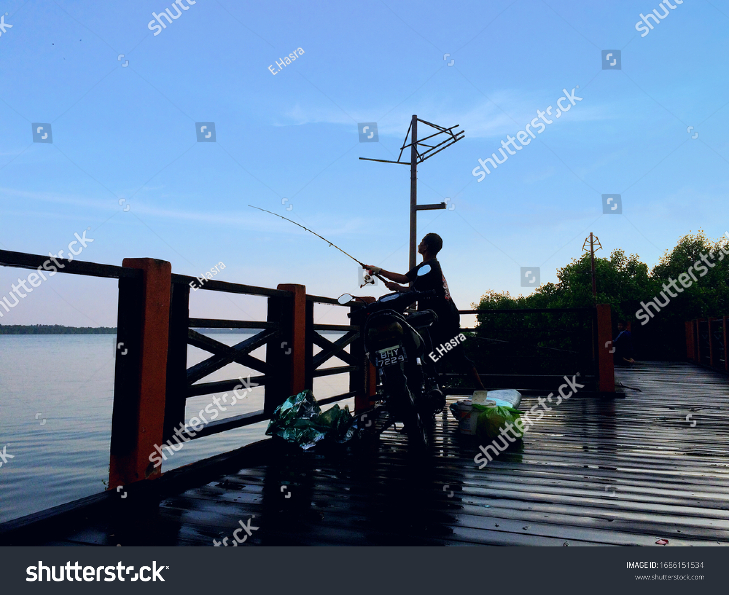 Man Fishing Laguna Park Pulau Indah Stock Photo Edit Now 1686151534