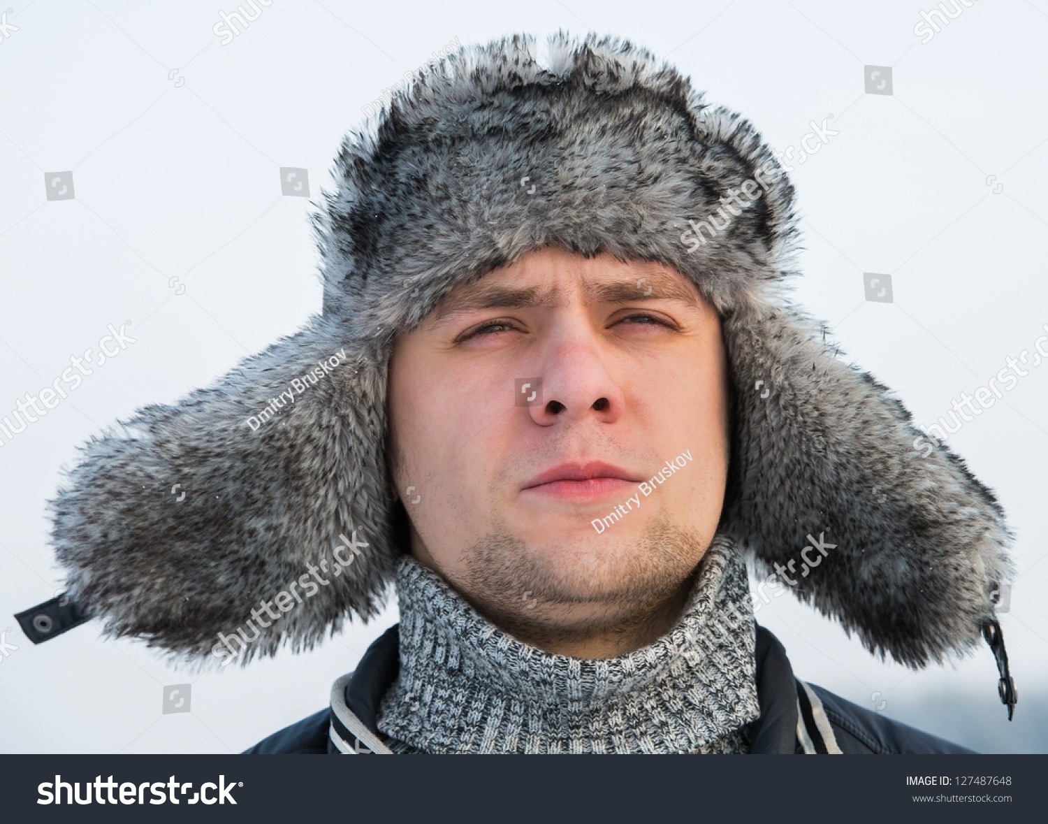 A Man In A Fur Winter Hat With Ear Flaps Stock Photo 127487648 ...