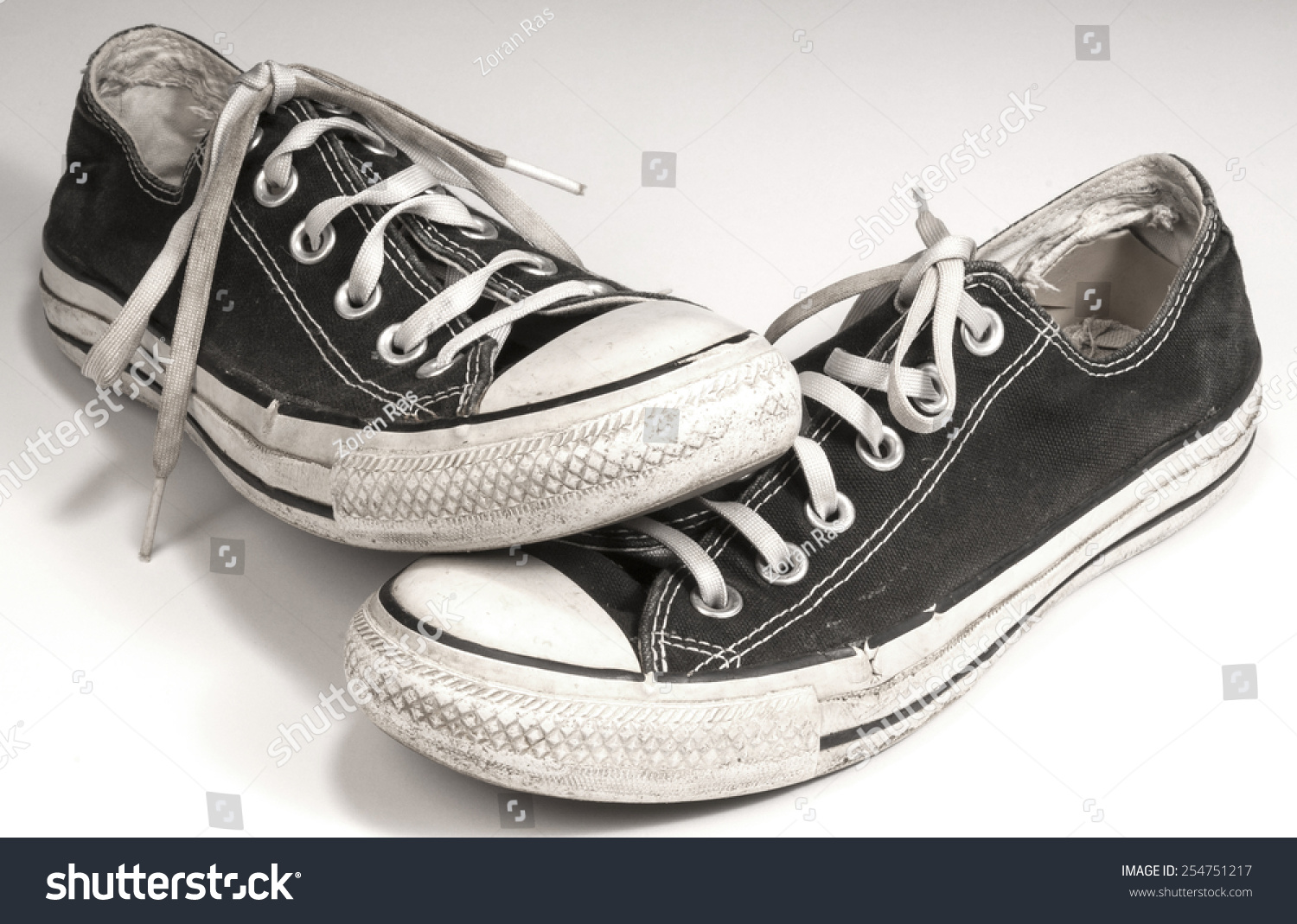 A Pair Of Black Canvas Sneakers On White Background Stock Photo ...