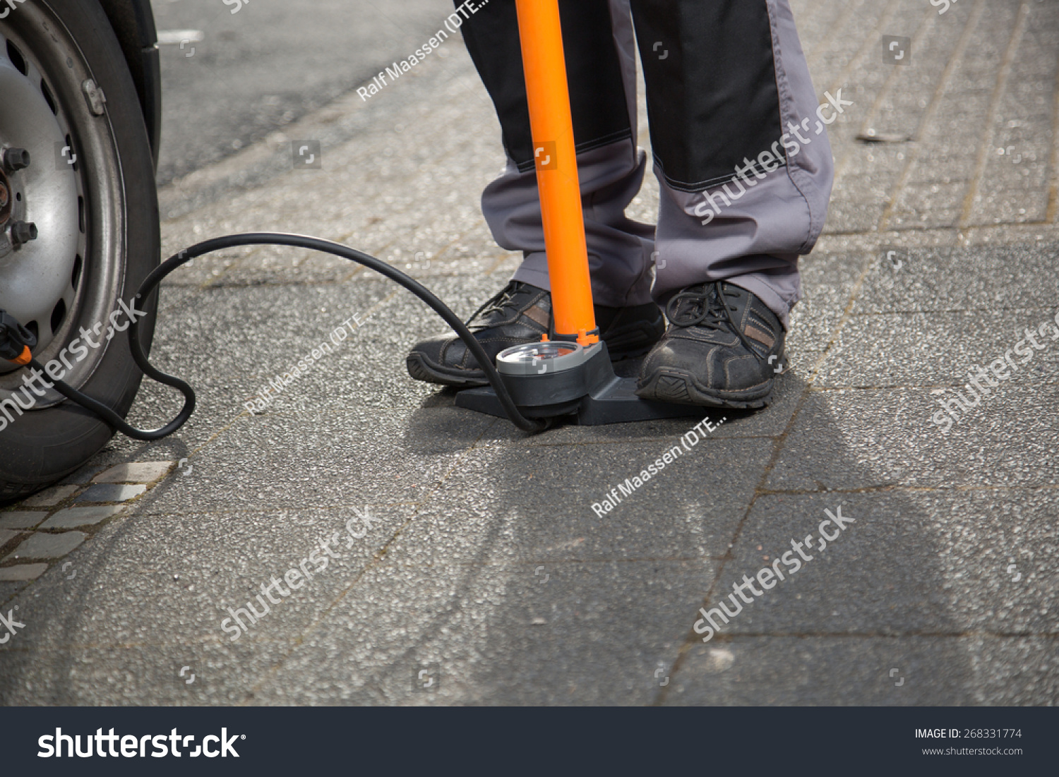 pumping air into car tires