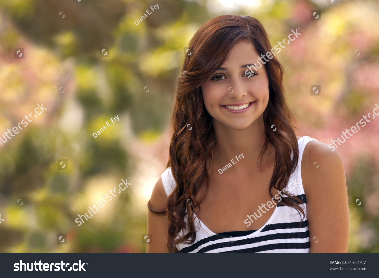 A Pretty Teenage Girls With A Beautiful Smile Poses Outdoors In A ...