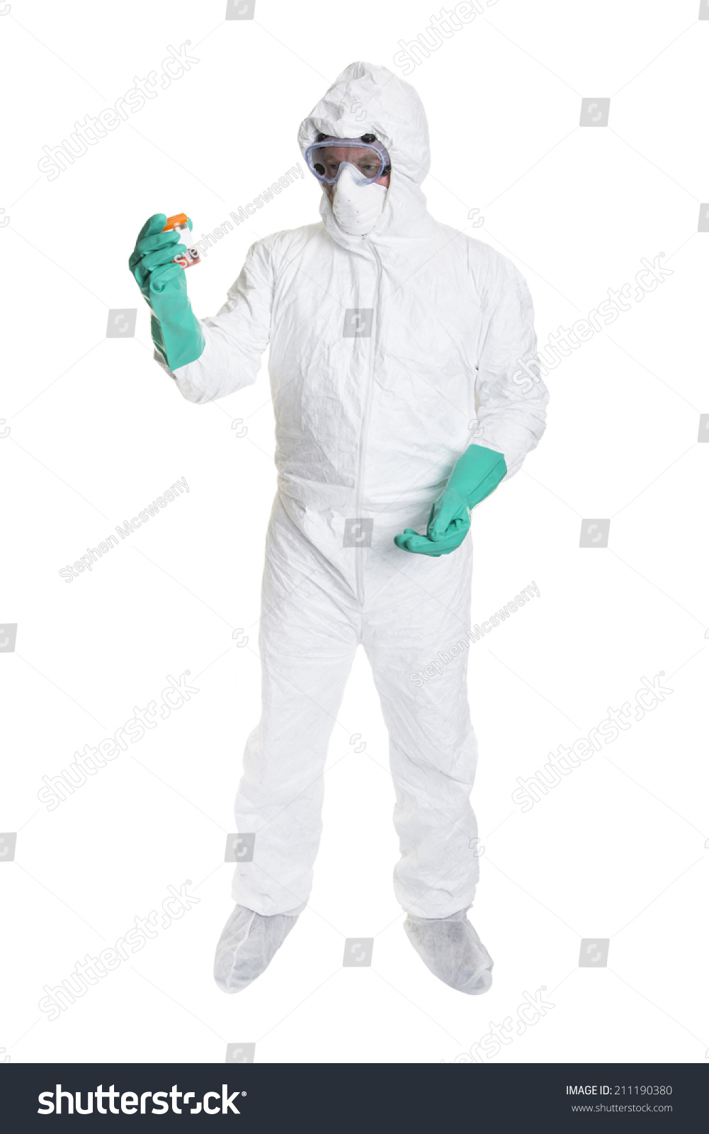 A Scientist In A Bio Hazard Suit Looking At A Sample Of Body Fluid ...