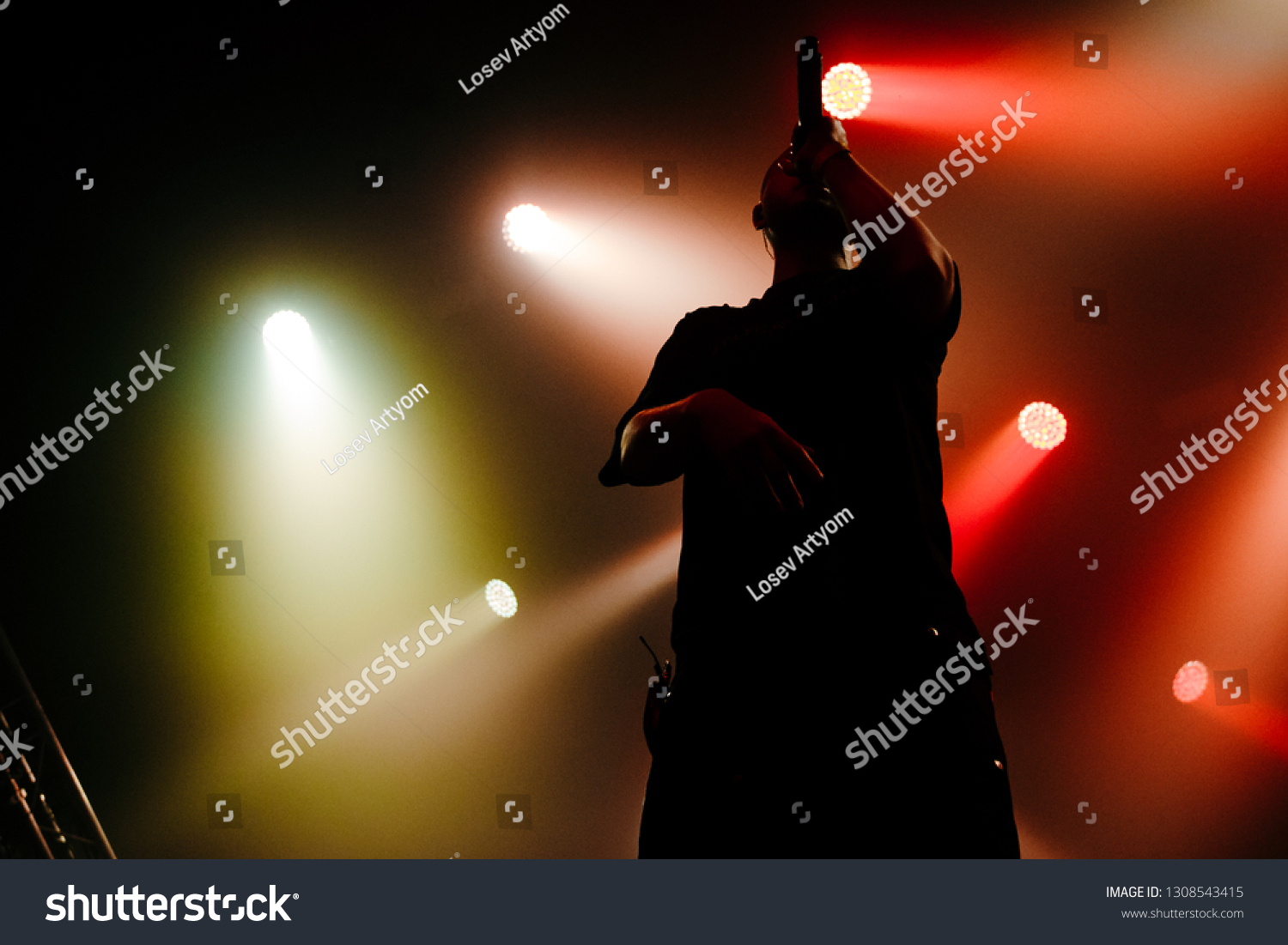 Silhouette Rap Artist On Stage Green Stock Photo Edit Now