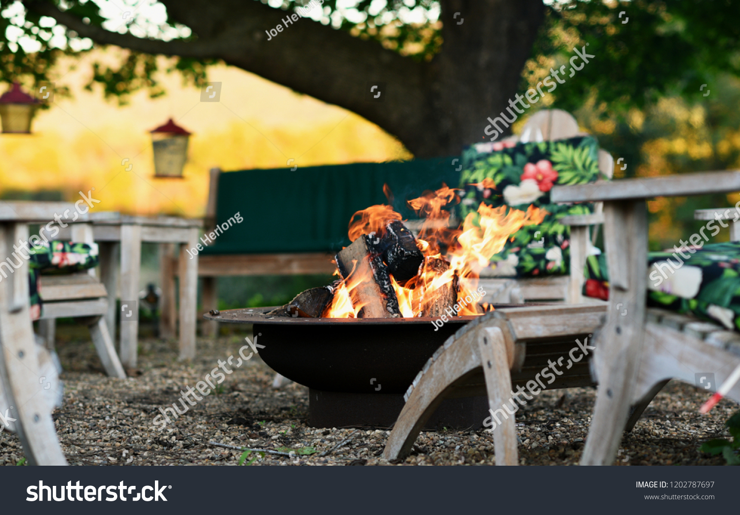 Sitting Area Around Roaring Fire Pit Stock Photo (Edit Now) 1202787697