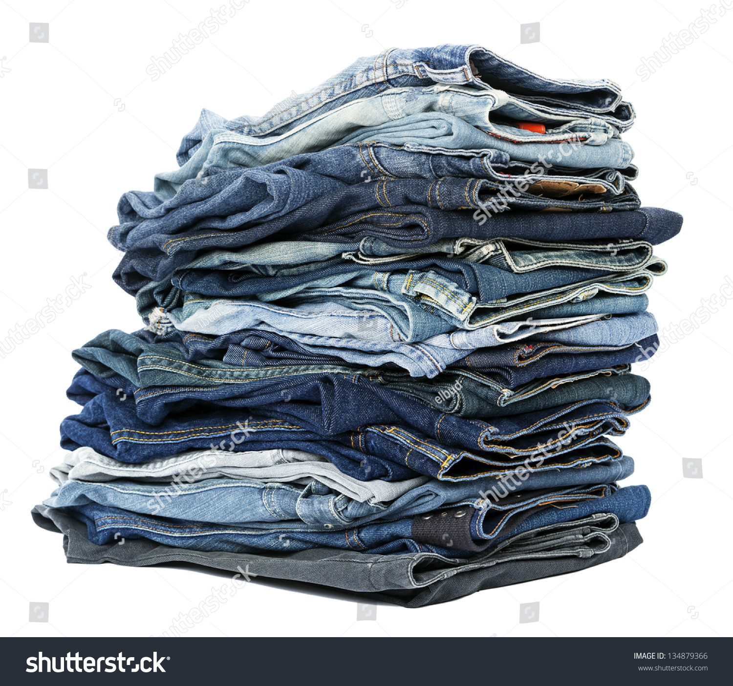 A Stack Of Various Pairs Of Jeans Pants Isolated On White Background ...