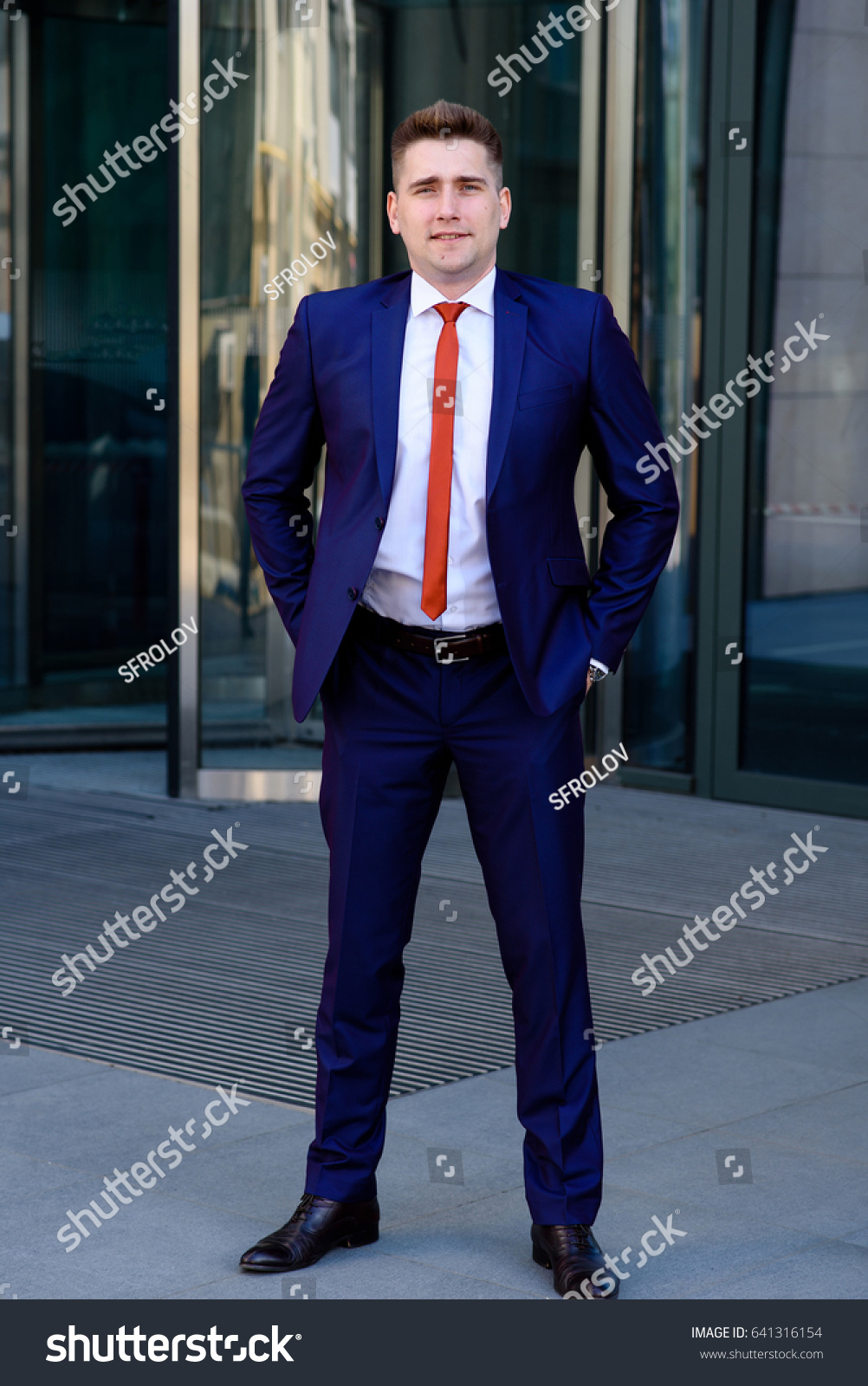 red tie on blue suit