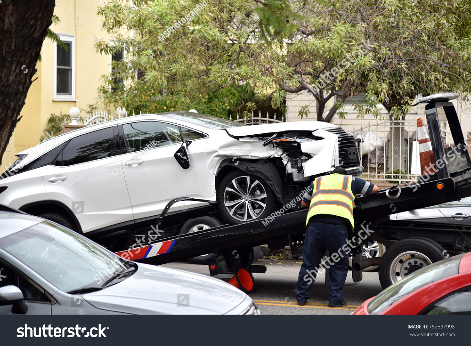 Tow Truck Driver Loading Wrecked Car Stock Photo Edit Now