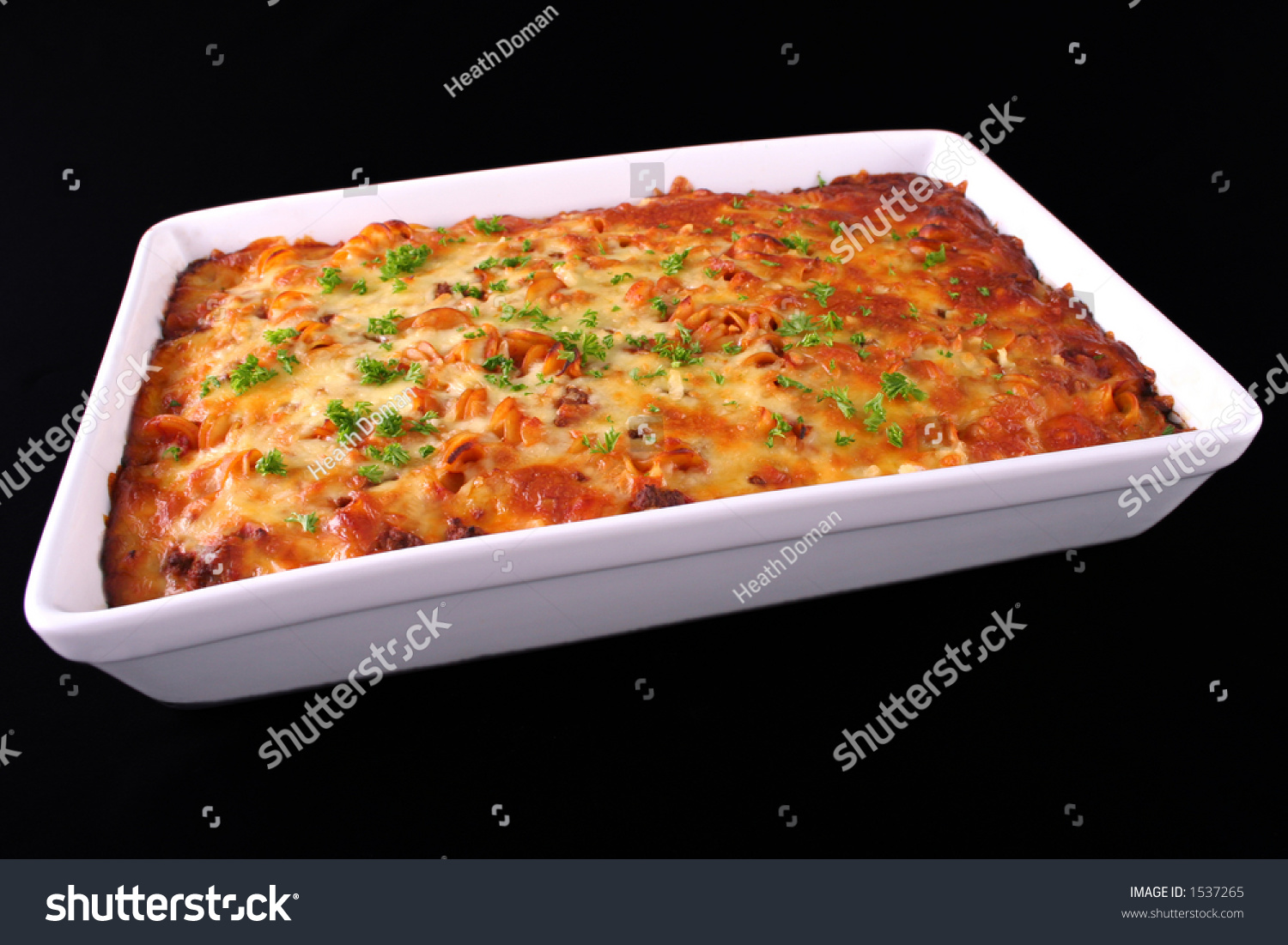 A Tray Of Freshly Cooked Pasta Bake Isolated On An Angle Stock Photo ...