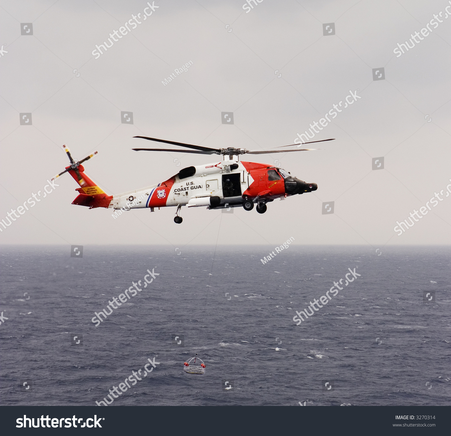 United States Coast Guard Helicopter Lowering Stock Photo 3270314 ...