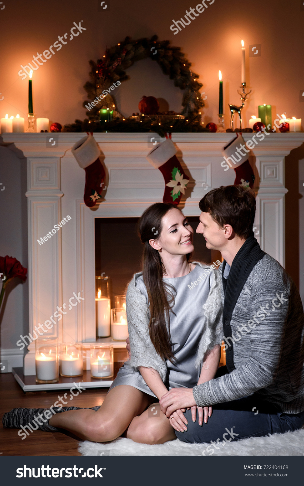 Christmas Gifts For Married Couples Young Part - 18: A Warm Picture Of A Married Couple In Love, Christmas Like Fireplace Behind Them.